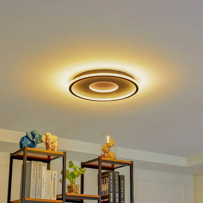 Lindby Deckenleuchte Edenia - L x B x H: 51 x 51 x 6,5 cm, schwarz - Eine moderne, runde LED-Deckenleuchte mit dunklem Rahmen, die warmes Umgebungslicht spendet.