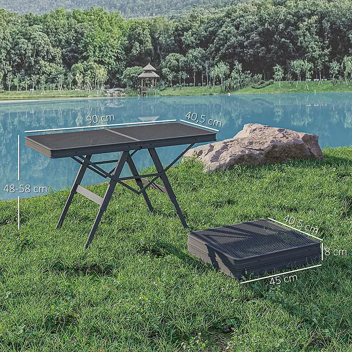 Outsunny Campingtisch - L x B x H: 90 x 40,5 x 58 cm, Schwarz - Dunkelgrauer faltbarer Mesh-Campingtisch, offen und zusammengeklappt auf Gras am See. Kompakt für draußen.