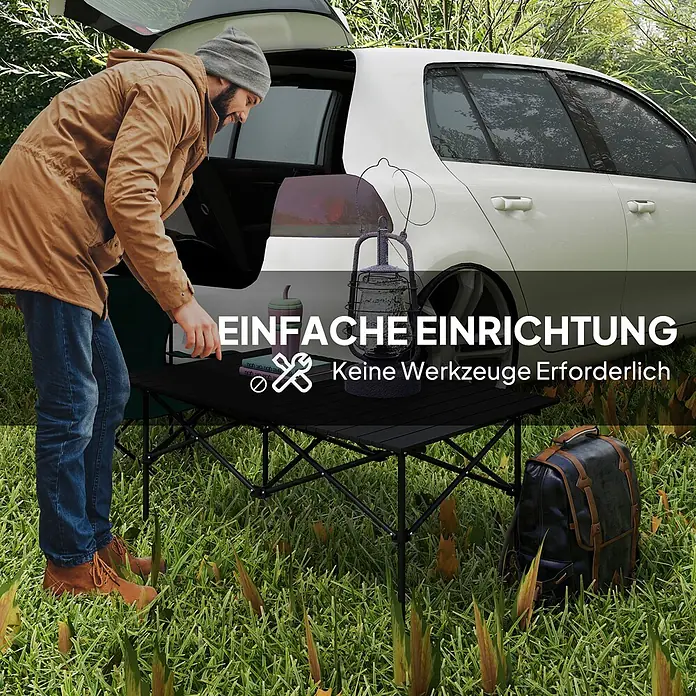 Outsunny Campingtisch - L x B x H: 95 x 55 x 50 cm, Schwarz - Schwarzer klappbarer Campingtisch wird von einem Mann draußen mühelos aufgebaut, keine Werkzeuge erforderlich.