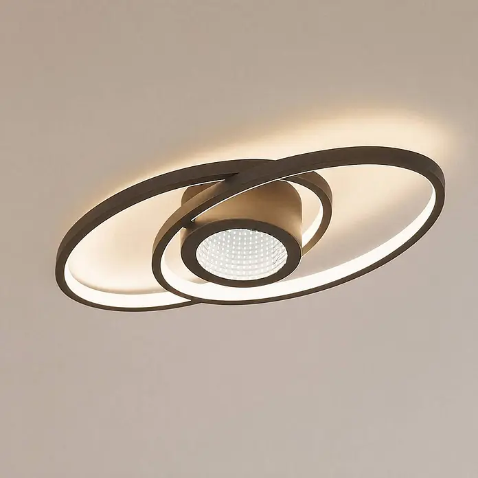 Lindby Deckenleuchte Thalina - schwarz, schwarz - Moderne dunkelbraune LED-Deckenleuchte mit überlappenden ovalen Ringen und zentralem Strahler, der warmes Licht ausstrahlt.