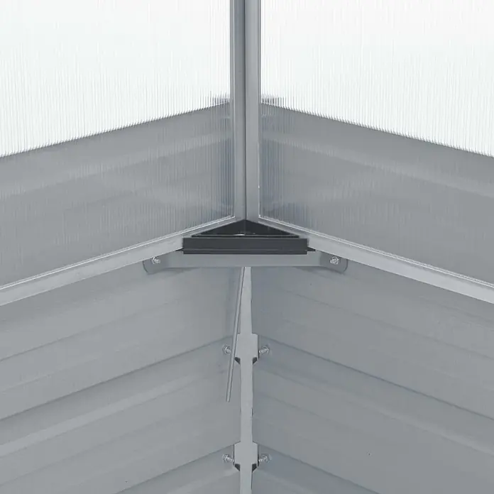 Furnicato Gewächshaus - 100 x 100 cm, Material Seitenwand: Kunststoff, Grau - Nahaufnahme einer Gewächshausecke innen mit silbernem Metallrahmen, transparenten Wellplatten und schwarzem Verbindungsstück.