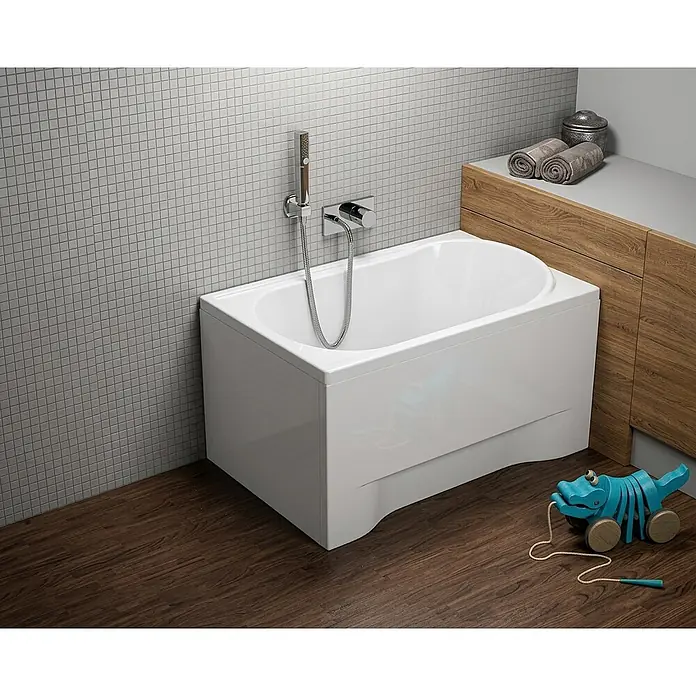Bad Land Badewanne MINI Acryl-Eckwanne 100 x 65 cm Weiß - 100 x 65 cm, Sanitäracryl, Weiß - Weiße, rechteckige Badewanne mit abgerundeter Innenseite, mit Handbrause an Fliesenwand.