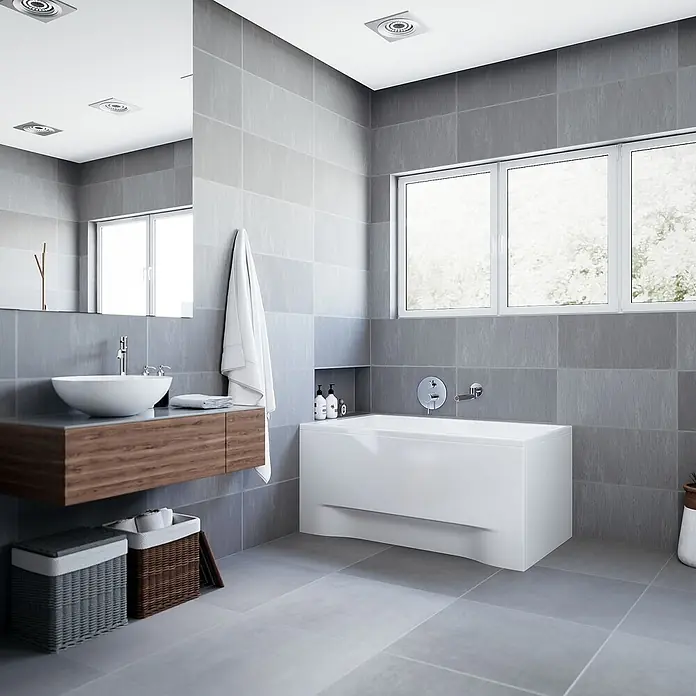 Bad Land Badewanne CAPRI Acryl-Eckwanne 100 x 70 cm Weiß - Sanitäracryl, Weiß - Modernes Badezimmer mit schwebendem Holzwaschtisch, weißem Waschbecken und weißer Badewanne auf grauen Fliesen.