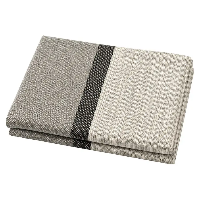 Manta para sofá multiusos - 130 x 170 cm, Textil, Perla-Antracita - Textil gris plegado con una franja central oscura, con texturas acanaladas y tejidas.