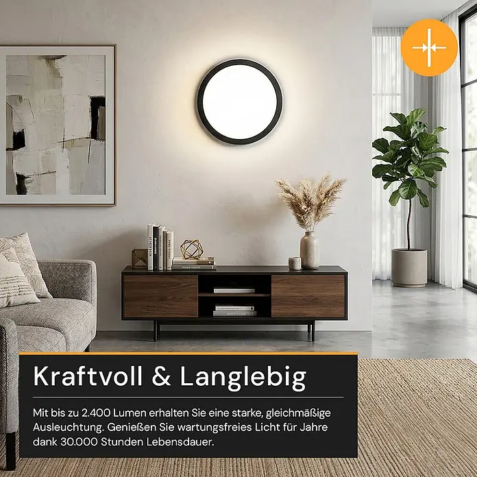 Enovalite LED-Deckenleuchte rund - 24 W, Ø x H: 29 x 1,95 cm, Schwarz, Schwarz, Mehrfarbig - Eine runde, schwarz gerahmte LED-Lampe an einer hellen Wand in einem modernen Wohnzimmer, die den Raum hell beleuchtet.