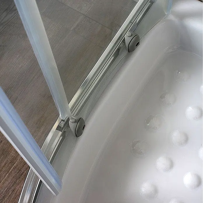 Kiamami Valentina Runddusche - 80 x 80 x 185 cm, Transparent - Klare Glasdusche mit Rollen, verbunden mit einer weißen Duschwanne mit erhöhten Antirutschkreisen.