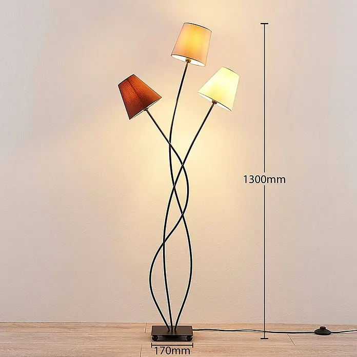 Lindby Stehleuchte Melis - creme / amber, E14 - Dreiflammige Stehlampe mit gewelltem schwarzem Metallgestell und quadratischem Sockel. Die Schirme sind braun, beige und cremefarben.
