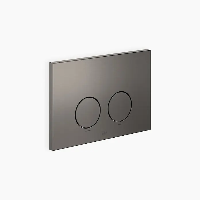 Dornbracht Betätigungsplatte -  - Dunkle Toilettenspülplatte aus gebürstetem Metall mit zwei runden Knöpfen.