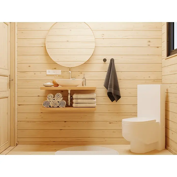 Palmako Caseta de jardín Cecilia - Medidas ext. (An x Pr): 813 x 680 cm, Madera, Natural - Baño de madera clara con lavabo blanco sobre estante flotante, espejo redondo y inodoro blanco moderno. Toallas ordenadas completan la estética natural.