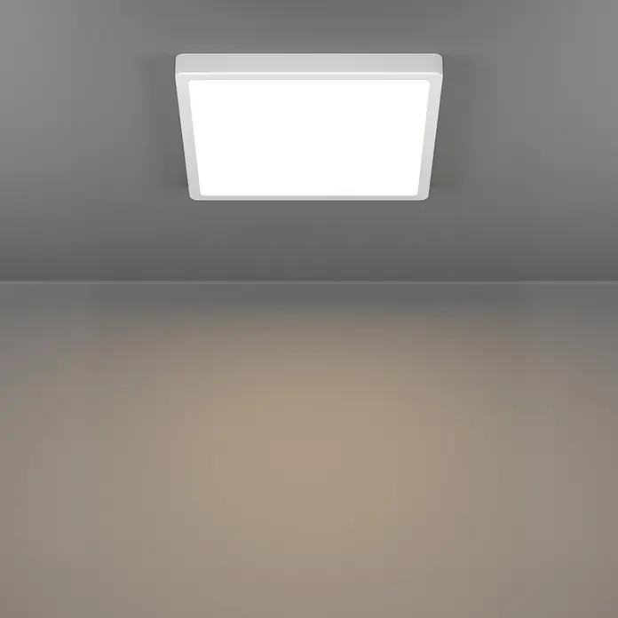 Eglo connect.z LED-Panel rund Rovito-Z - 16 W, Ø x H: 30 x 3 cm, Schwarz, RGBW - Weißes quadratisches LED-Panel an grauer Decke, beleuchtet eine hellbraune Wand.