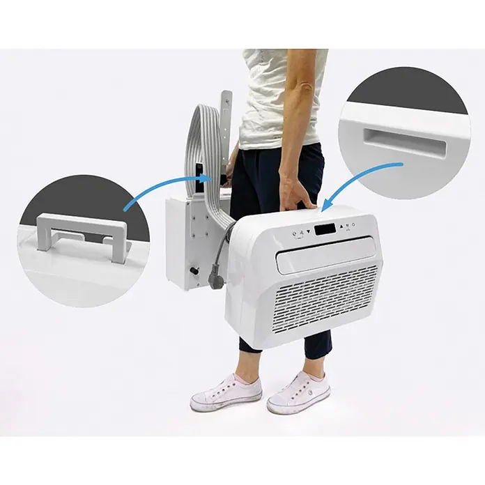 Sannover Mobiles Klimagerät - 1,5 kW, Raumgröße: 12 m², weiß - Person trägt ein weißes tragbares Klimagerät, dessen integrierte Tragegriffe hervorgehoben werden.