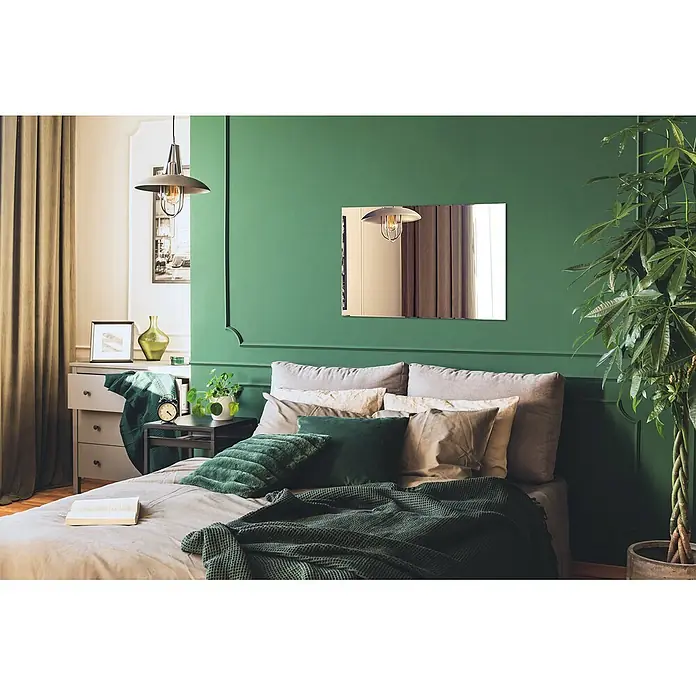 Tulup Wandspiegel - 70 x 100 cm - Ein stilvolles Schlafzimmer mit einem gemütlichen Bett, neutralen und grünen Kissen und einer dunkelgrünen Decke.