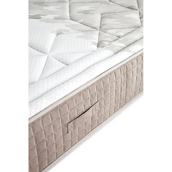 Nonnos Bedding Colchón Memory Spring - Largo: 200 cm, Ancho: 160 cm, Altura: 29 cm, Viscoelástica - Primer plano de un colchón acolchado blanco y gris claro, con un borde lateral beige con asa.