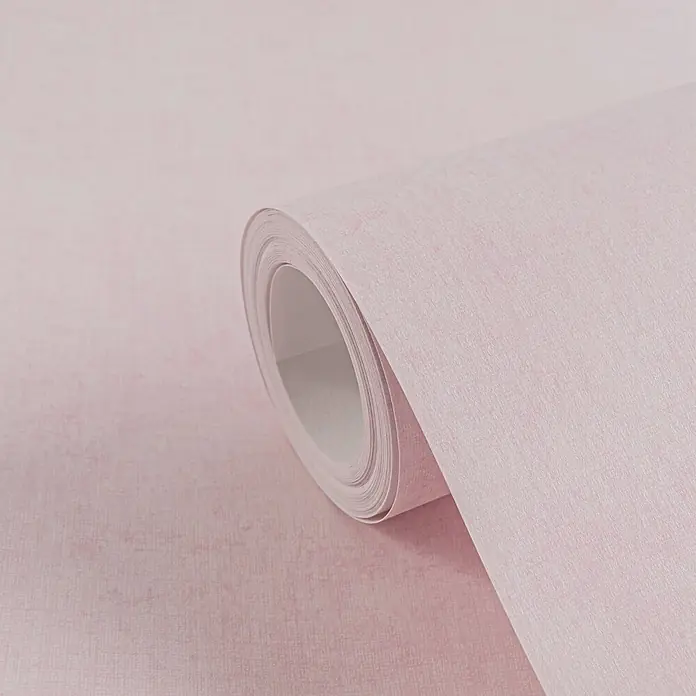 Profhome Vliestapete Vliestapete Kindertapete, Used Look, Textiloptik, Uni in rosa - rosa,lila, 10.050 x 530 mm - Rolle rosa strukturierter Tapete, teilweise abgerollt, um ihr dezentes Muster zu zeigen.