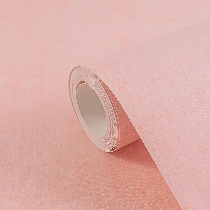 Profhome Vliestapete Vliestapete Kindertapete, Used Look, Textiloptik, Uni in rosa - lachs-rot, 10.050 x 530 mm - Rosa Tapetenrolle mit feiner, leinenartiger Textur, teilweise ausgerollt.