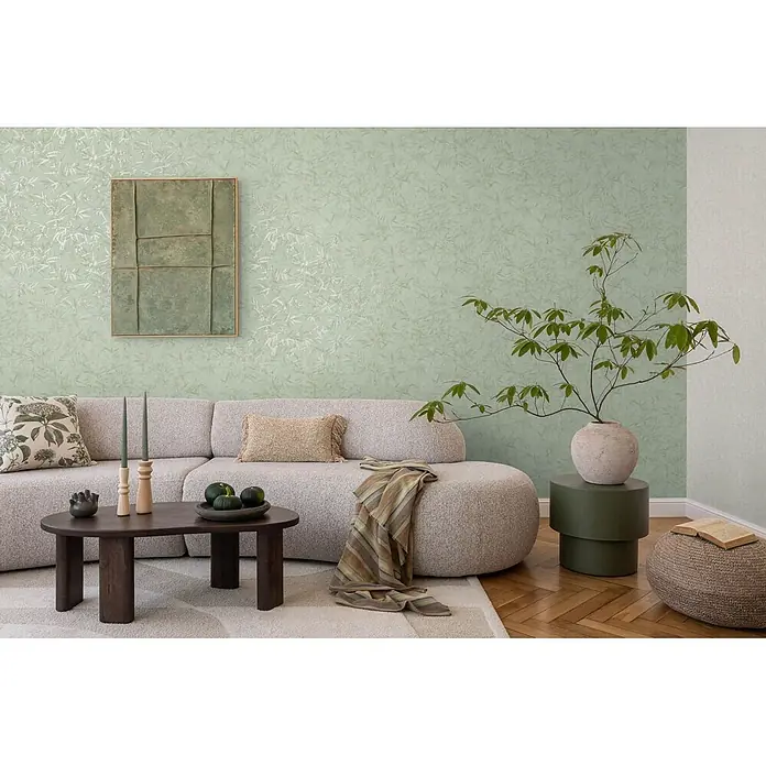 Profhome Vliestapete Heißgeprägte Vliestapete Ton-In-Ton, Floral, Textiloptik in grün - minz-grünsilber, 10.050 x 530 mm - Hellgrüne Tapete mit subtilem Blattmuster an einer Wohnzimmerwand.