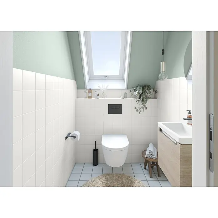 Alpina Wandfarbe Bad & Küche Salbei - Grün, Matt, 2,5 l - Eine moderne, wandhängende weiße Toilette in einem zeitgenössischen Badezimmer mit hellgrünen und weiß gefliesten Wänden.