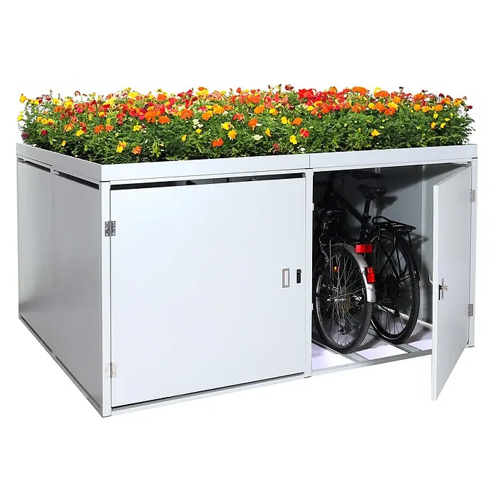 Proregal Fahrradgarage 4er mit Pflanzkasten - Stahl, Grau - Graue Metall-Fahrradbox mit integriertem Blumenkasten voller bunter Blumen. Eine Tür ist geöffnet und zeigt zwei Fahrräder darin.