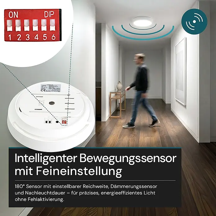 Luxula LED-Deckenleuchte rund - 24 W, Weiß, Warmweiß - Weißer runder Deckenbewegungssensor mit sichtbaren DIP-Schaltern zur Feineinstellung, in einem Flur installiert.