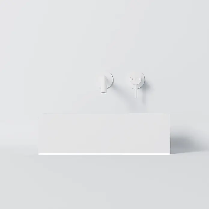 Vola Waschtisch - 0 x 0 cm - Weißes rechteckiges Waschbecken mit wandmontierten weißen Armaturen und Bedienelementen.