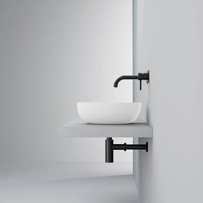 Vola Waschtisch - 0 x 0 cm - Weißes Aufsatzwaschbecken mit schwarzem Wandhahn und schwarzem Siphon.
