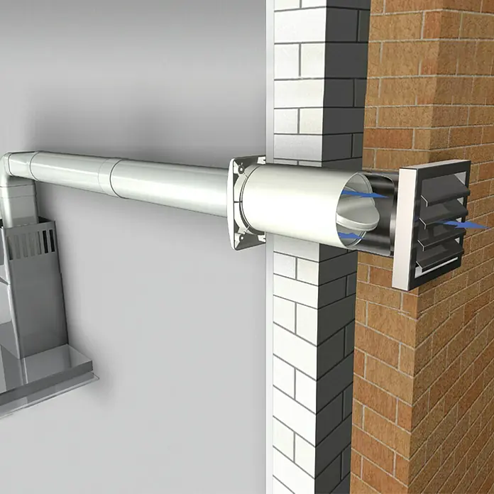 Air-Circle Aeroboy Energiespar-Mauerkasten - Durchmesser: 125 mm, Max. Luftleistung: 600 m³/h, Edelstahl - Ausschnitt eines Dunstabzugssystems mit weißem Rohr, das durch eine Wandöffnung führt, abgeschlossen durch eine Entlüftungsklappe.