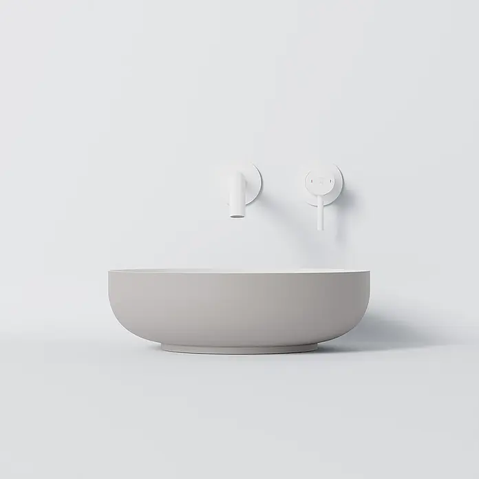 Vola Waschtisch - 0 x 0 cm - Helles graues, rundes Waschbecken mit weißer Wandarmatur und Drehregler.