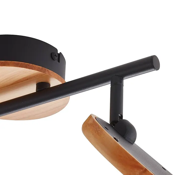 Lindby Deckenstrahler Manel - L x B x H: 37 x 13 x 22 cm, Holz hell, Holz hell - Nahaufnahme eines Leuchtenfußes und Arms aus schwarzem Metall und hellem Holz.
