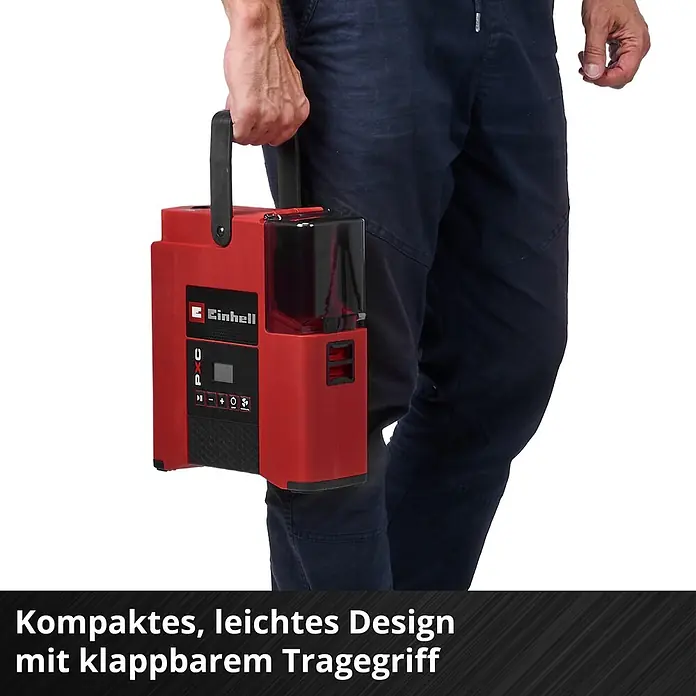 Einhell Akku-Kompressor Suppero 18/380 - 18 V, 1,38 bar - Person trägt kompaktes rotes Einhell-Gerät mit klappbarem Tragegriff.