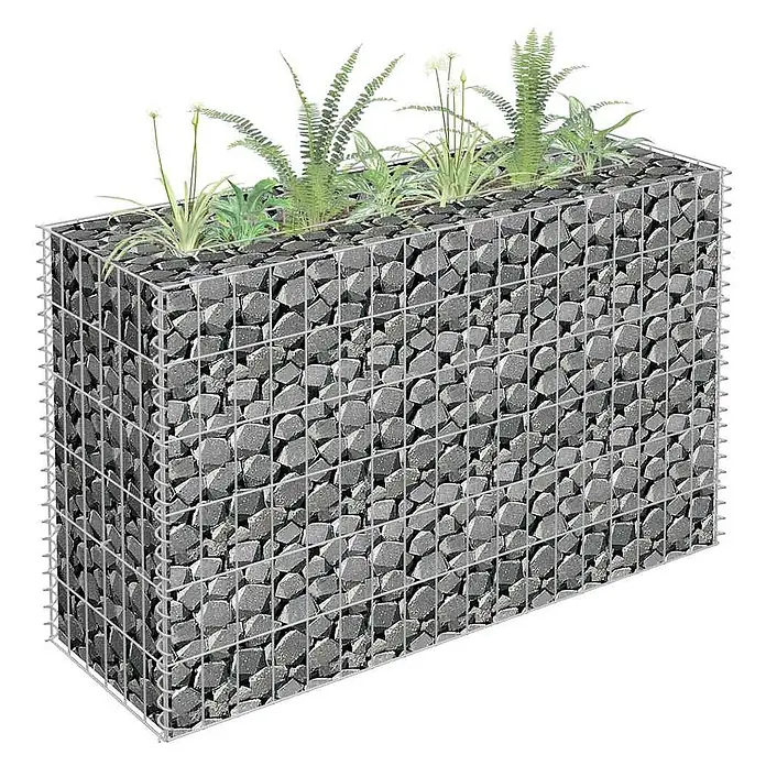 Furnicato Gabionen-Hochbeet - 30 x 90 x 60 cm - Gabionen-Hochbeet aus Drahtgeflecht mit dunkelgrauen Steinen, bepflanzt mit Grünpflanzen und kleinen weißen Blüten.