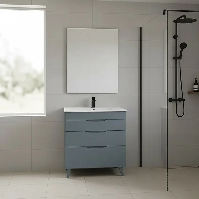 Conjunto de mueble de baño Turia - Azul, 3 pzs. - Mueble de baño gris azulado con tres cajones, lavabo blanco y grifo negro, en un baño moderno.