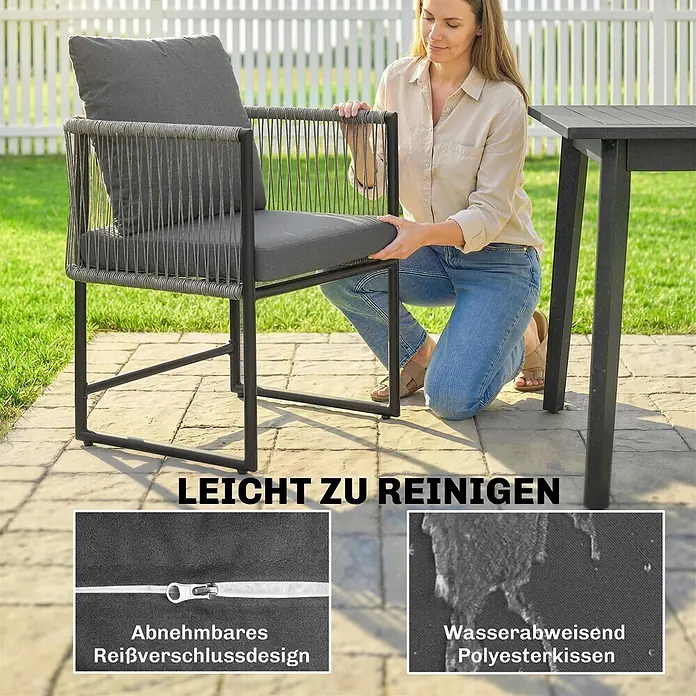 Outsunny Gartenstuhl-Set - 2 Stk., Stahl, PE-Rattan, Dunkelgrau - Frau legt abnehmbares, wasserabweisendes graues Kissen auf einen dunkelgrauen Outdoor-Stuhl mit geflochtenen Details, betont leichte Reinigung.