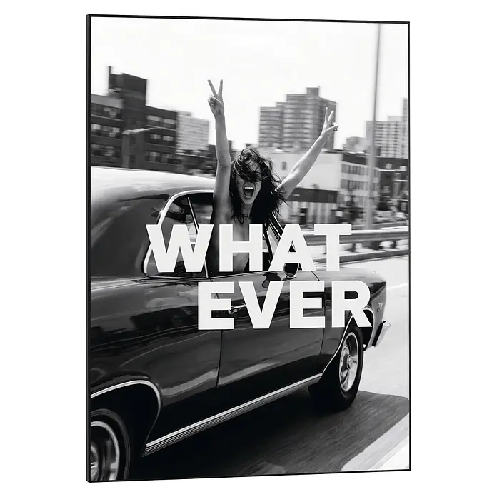 Reinders Bild Slim Frame Black - What Ever, B x H: 50 x 70 cm - Schwarz-weißer gerahmter Kunstdruck einer jubelnden Frau in einem Oldtimer mit Friedenszeichen und dem Text 'WHAT EVER'.