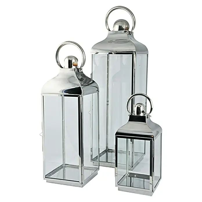 Farolillo de acero inoxidable Berta - 24 x 24 x 79 cm - Juego de tres faroles plateados con paneles de vidrio transparente, ideal para crear un ambiente cálido en interiores o exteriores.