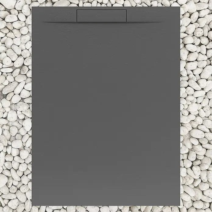 FRASCIO New Tecnology Duschwanne Duschwanne - L x B: 1.200 x 900 mm, Verbundwerkstoff, Grau - Anthrazitfarbene rechteckige Duschwanne mit linearem Abfluss, umgeben von weißen Kieselsteinen.