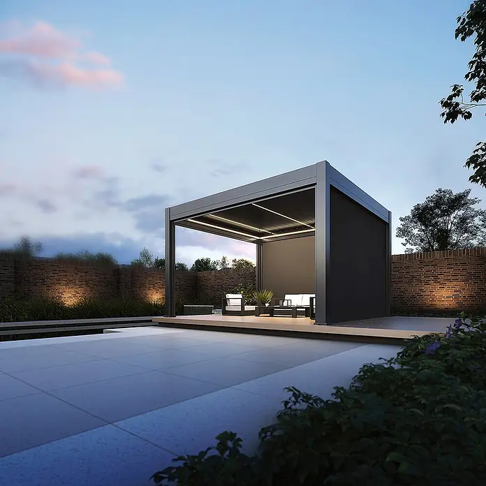 Weide Pergola Prestige freistehend Aluminium 3,6 x 4 m Anthrazit - B x T: 400 x 360 cm, Farbe Gestell: Sandpapier FinishAnthrazit / RAL Farbcode 7024, Aluminium - Moderne dunkelgraue Pergola mit integrierter Beleuchtung und Gartenmöbeln auf einer Terrasse.