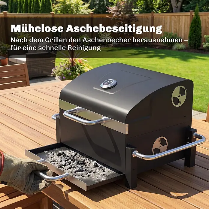 Outsunny Smoker -  - Schwarzer Holzkohlegrill mit herausnehmbarer Aschewanne, die von einer behandschuhten Hand zur einfachen Reinigung nach dem Grillen entnommen wird.