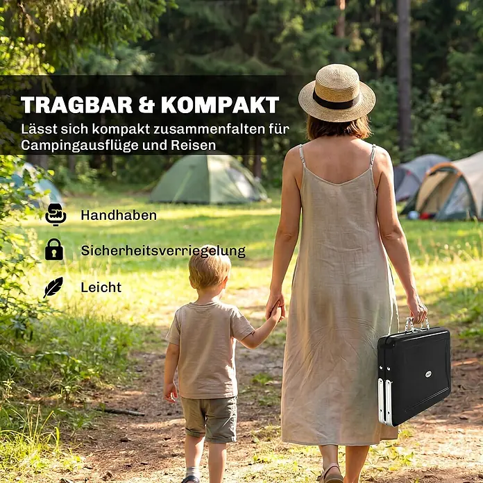 Outsunny Holzkohlegrill - Durchmesser Grillfläche: 32 cm, Schwarz - Person trägt einen schwarzen, kompakten Klapptisch/Koffer mit silbernen Griffen durch ein Waldcamp.