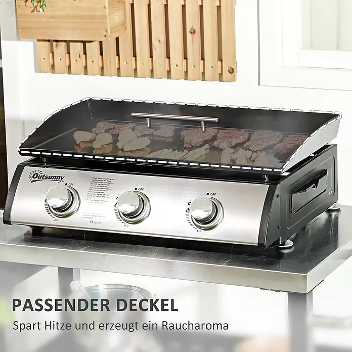 Outsunny Gasgrill - Anzahl Brenner: 3 Stk. - Eine Outsunny Gasgrillplatte aus Edelstahl kocht Fleisch und Gemüse mit offenem Deckel auf einer Metalltheke.