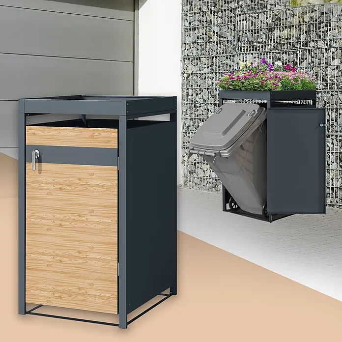 ML-Design Mülltonnenbox Mülltonnencontainer mit Klappdeckel/Tür für 1 Tonne 120 oder 240 Liter - Stahl, Anthrazit, Hellbraun, Geeignet für Anzahl Mülltonnen: 1 Stk. - Zwei dunkelgraue Mülltonnenboxen aus Metall: eine geschlossen mit Holzoptik-Paneel, eine offen mit gekippter Tonne und Blumenpflanzgefäß.