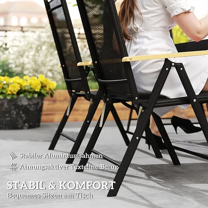 Outsunny Gartentisch-Set - Gesamtumfang: 7 -tlg., Aluminium, Kunststoff, Texteline, Klappbar - Zwei schwarze Gartenstühle mit Aluminiumrahmen und Textilene-Bezug, einer besetzt, im Außenbereich.