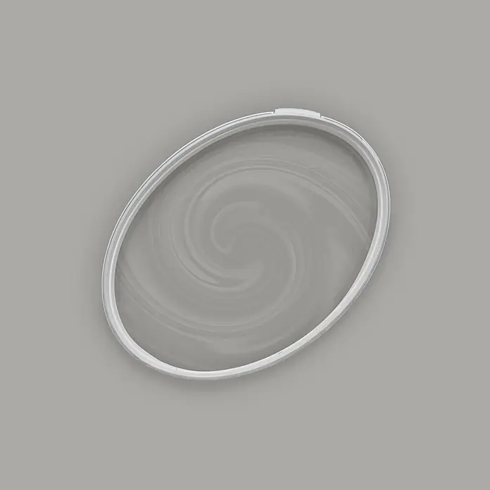 Tadessi Wandfarbe Zementgrau - Grau, Matt, 2,5 l - Weißer ovaler Ring mit grauem Wirbelmuster innen.