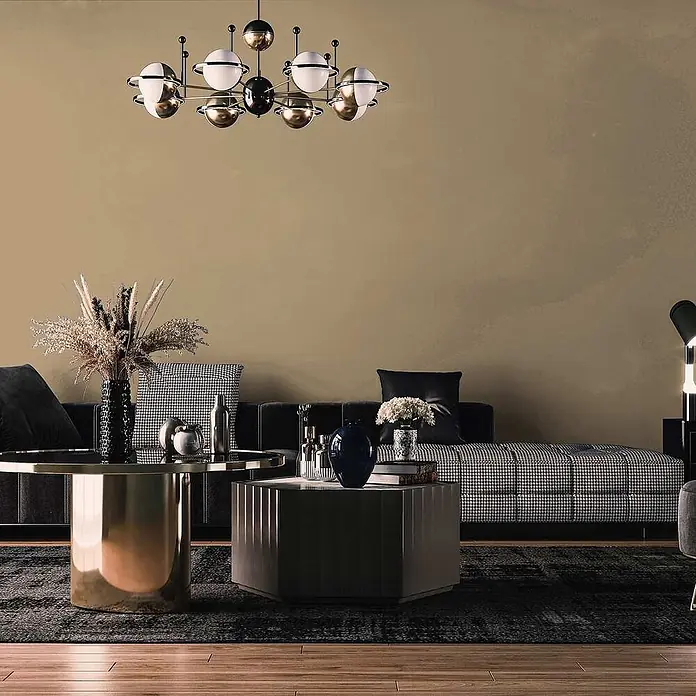 Tadessi Wandfarbe Sandbraun - Beige, Matt, 2,5 l - Moderne schwarz-goldene Pendelleuchte mit weißen Kugel-Schirmen, die ein stilvolles Wohnzimmer beleuchtet.