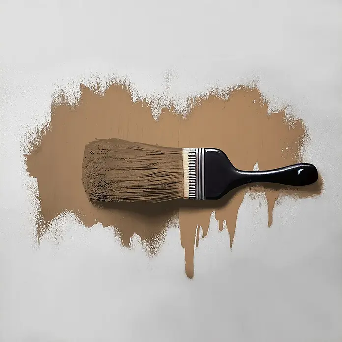 Tadessi Wandfarbe Mocha - Braun, Matt, 5 l - Ein Pinsel trägt einen breiten braunen Farbstrich auf, mit Farbtropfen darunter.