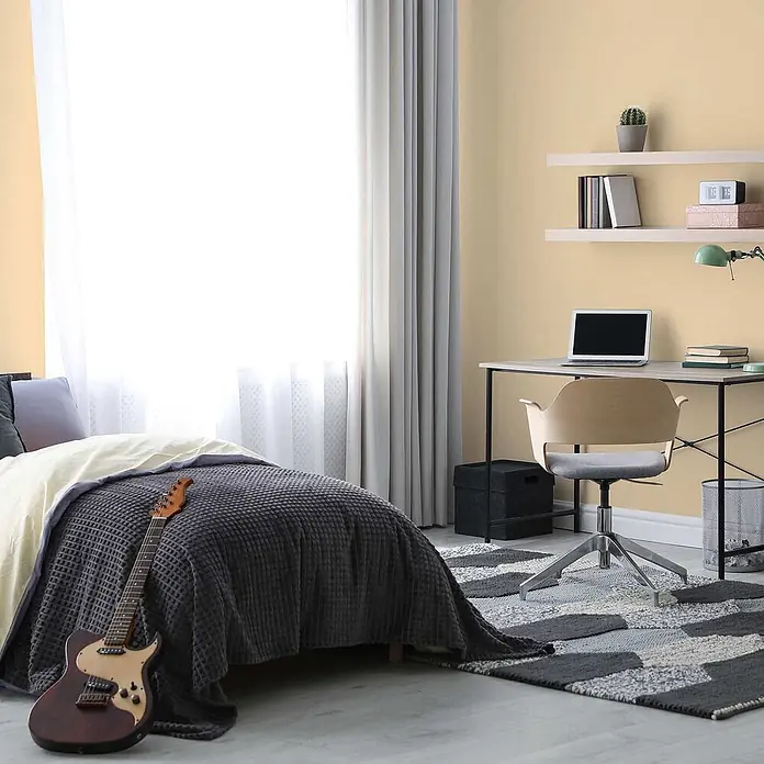 Tadessi Wandfarbe Graubeige - Beige, Matt, 5 l - Dunkelgrauer Waffelstrick-Bettüberwurf auf einem Bett in einem modernen Schlafzimmer.