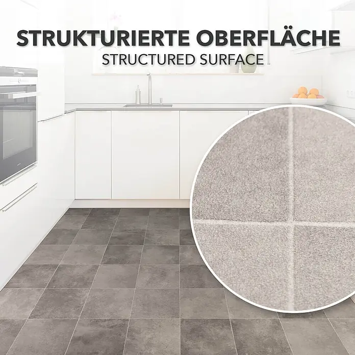 Vinylboden CV-Belag - 600 x 100 cm, Zala 997M - Graue, strukturierte Bodenfliesen in einer modernen Küche.