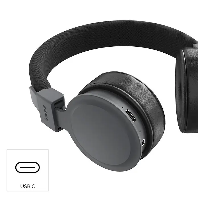 Hama Kopfhörer Freedom Lit III On Ear Bluetooth Headset -  - Graue und schwarze Over-Ear-Kopfhörer mit sichtbarem USB-C-Ladeanschluss.