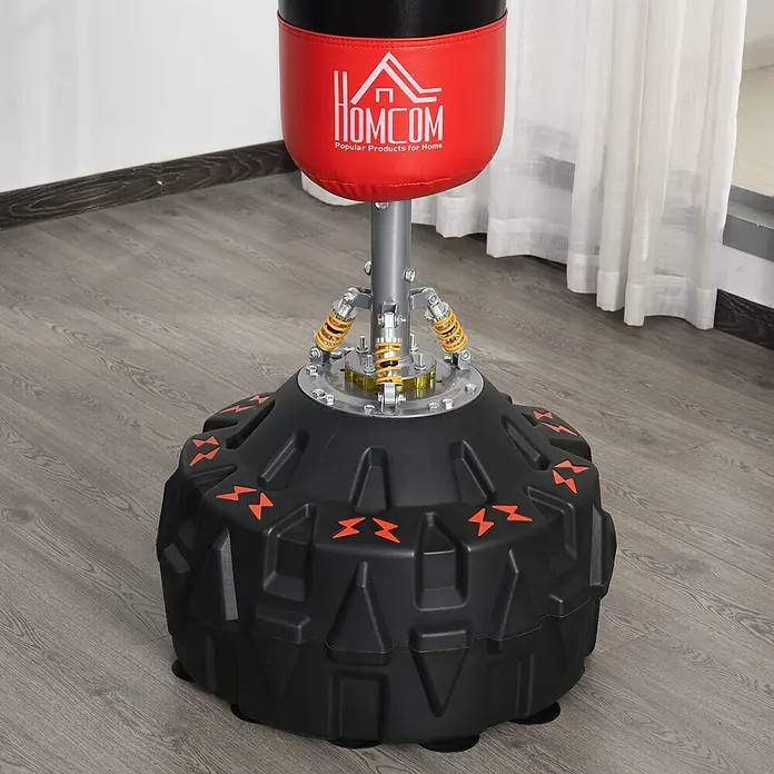 Homcom Boxsack - Schwarz - Roter und schwarzer freistehender Boxsack mit schwarzem Sockel und sichtbaren gelben Federungsmechanismen.