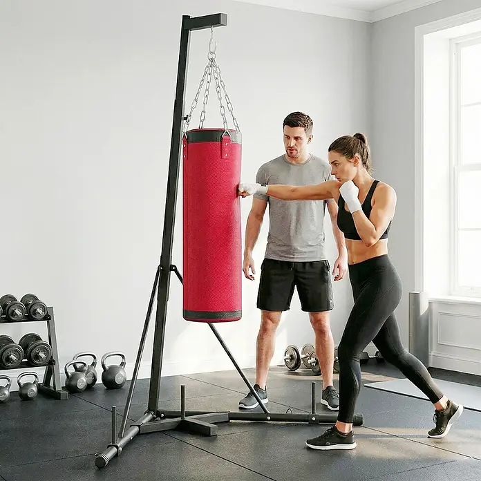 Sportnow Boxsack - Rot - Roter Boxsack auf schwarzem freistehendem Ständer, zum Boxtraining verwendet.