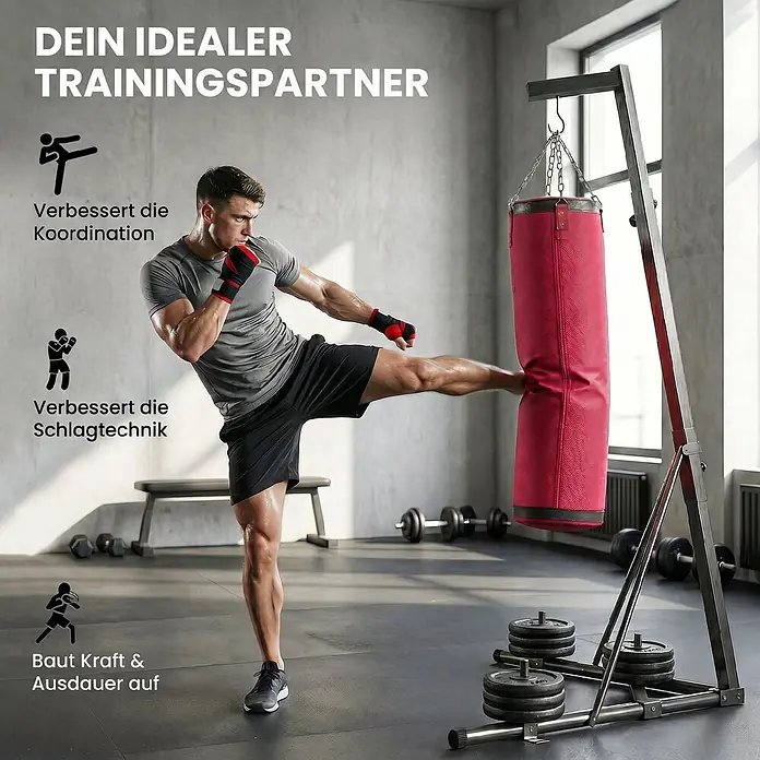 Sportnow Boxsack - Rot - Ein Mann im Fitnessstudio tritt gegen einen roten Boxsack an einem stabilen Metallständer, der mit Gewichten beschwert ist.